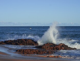 waves crashing on rocks