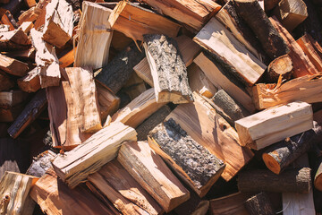 Background dry chopped firewood ready for winter