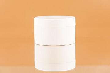 Unbranded plastic jar for cosmetics products. Skincare and cosmetology mockup. Branding identity mockup concept