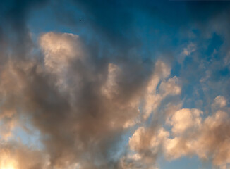 Drifting Clouds in Evening Light of Sunset on Blue Sky Background - Overcast Western Sky in Spring Dusk Time - Belarus Minsk