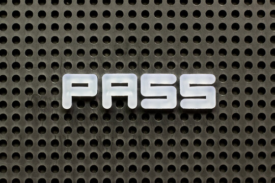 White color letter in word pass on black pegboard background