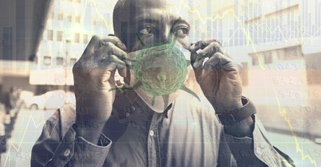 Composition of data processing and covid 19 cell over man wearing face mask in city
