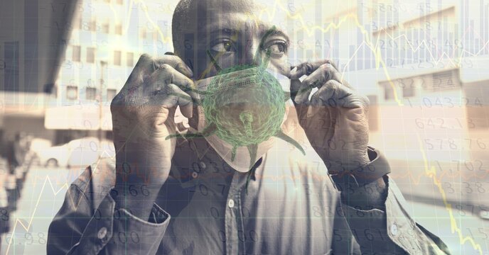 Composition of data processing and covid 19 cell over man wearing face mask in city