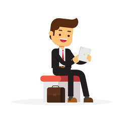 Sitting business man using his tablet