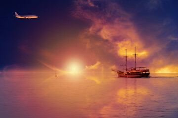 A vintage ship sails towards the sunset. Tourism services concept.