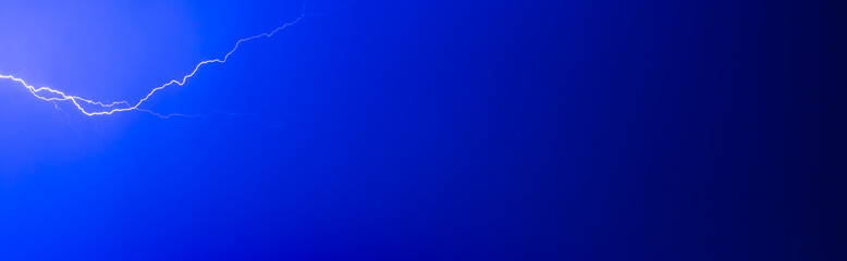 Panorama with navy sky and thunder light.
