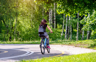 Cyclist ride on the bike path in the city Park
