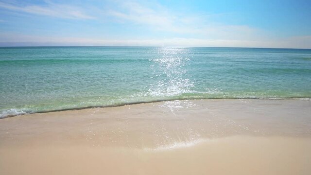 Shiny glitter shimmer wave sun reflections on sea ocean water with small ripples on sunny day on beach at Miramar or Destin city town, Florida panhandle of Gulf of Mexico