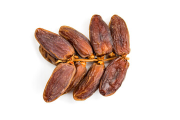 Twig with date fruits. Fruit dates. Dates isolated on a white background. Twig with dates close up,...