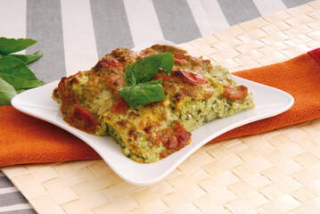 Lasagna with pesto and tomatoes (ph. Archivio Collection)