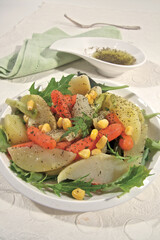 Warm salad with potatoes and carrots (ph. Archivio Collection)