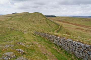 Fototapeta na wymiar Following the path of Hadrians Wall over the hills of Northumbria