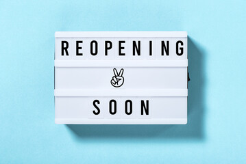 Reopening soon Light box with text blue background