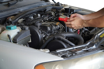 Mechanic is using a diagnostic car code reader.