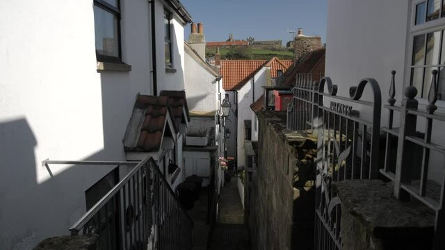 Narrow street leading to River Esk, Whitby, North Yorkshire, England, United Kingdom, Europe