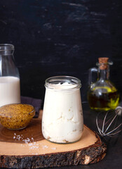Vegetarian mayonnaise. Ingredients for mayonnaise oil, milk and mustard. Homemade mayonnaise