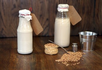 Buckwheat milk in a bottle. Delicious homemade Botteled milk as eco product for vegans. Healthy organic nutrition concept