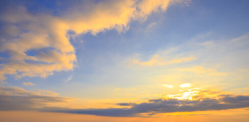 Naklejka na ściany i meble Sunlight sunrays or sunbeams over clouds and blue sky like heaven for background.