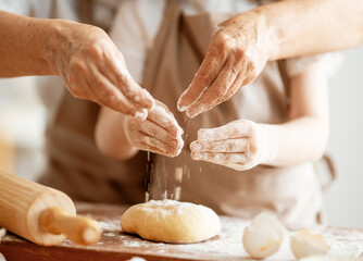 Hands preparing dough