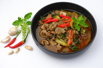Stir -Fried Basil with Chicken Offal on black dish on white background