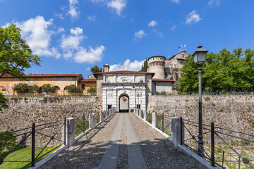 Fototapeta na wymiar Main entrance to the historic castle and park of Brescia city. Lombardy, Italy