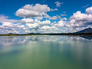 Forggensee Allgäu from above - Aerial view with mirroring clouds on a sunny day at the feet of the...