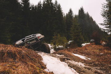 Offroad car jump in the mountains. Pollen, swamp and snow. Affortation, suspension, tires © Yaroslav