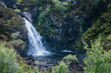 Fototapeta na wymiar A spring 3 shot HDR image of Eas Dubh waterfall flowing into th Inverianvie River near Gruinard Bay in Ross and Cromarty, Scotland