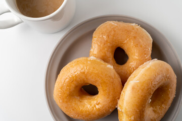 glazed donuts and coffee image. top view