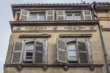 Obraz premium Architectural fragments of the design of an old French house in Toulouse Old town. Toulouse, Haute-Garonne, France.