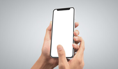 Hand holding smartphone device touching screen