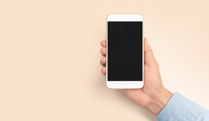 Hand holding smartphone device touching screen