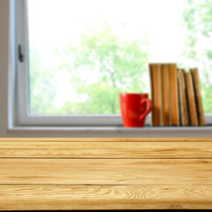Wooden desk of free space and window background 