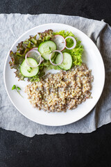 green buckwheat salad vegetables lettuce mix meal snack copy space food background rustic. top view diet vegan or vegetarian food