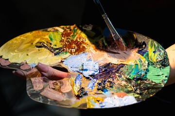 Color life. Creative process. Art tools. Painting artwork. Unrecognizable woman holding palette...