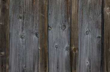 A wooden background of old vertical boards with bitches and rusty nails with empty template with place for text. copyspace
