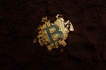 golden bitcoin on soil background. cryptocurrency concept