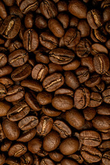 Close-up pattern of brown roasted coffee beans. Can use for background