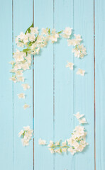 white flowers on идгу wooden background