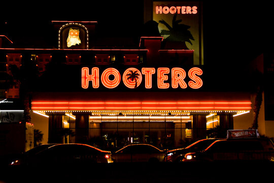 Las Vegas, Nevada, USA - February 2019: Signs and cars outside the entrance to the Hooters Hotel in Las Vegas.