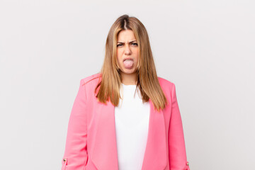 curvy pretty blonde woman feeling disgusted and irritated and tongue out