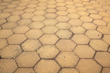 yellow hexagon walkway. Street being paved yellow tiles for background