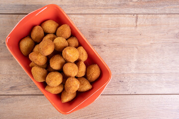 Traditional Brazilian fried snack stuffed with chicken . Coxinha de frango