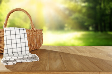 Wooden picnic basket of free space and summer landscape. 