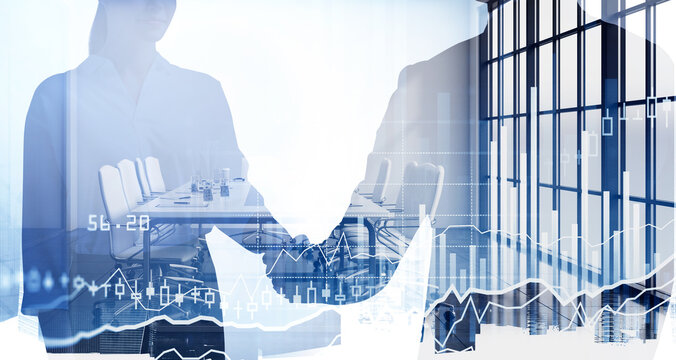 Silhouettes of businessman and businesswoman having a handshake. Panoramic city view in the background. Forex candlestick in the foreground. Concept of networking and cooperation on stock market © ImageFlow