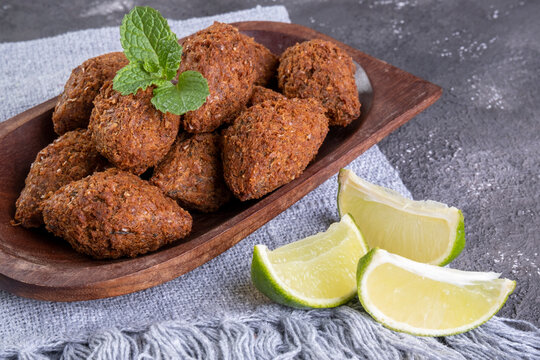 Traditional Arabian fried snack made with wheat and stuffed with minced meat. Quibe