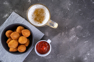 Traditional Brazilian fried snack stuffed with chicken and a glass of beer. Coxinha