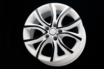 car alloy wheel, unusual white with black paint on the spokes. The disk for autotuning, beautiful