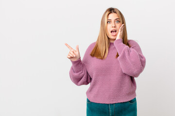 curvy pretty blonde woman feeling shocked and scared