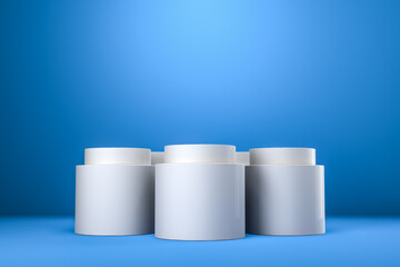 Round product display podium. Minimal white geometric shape stage scene on blue background. 3d rendering.
